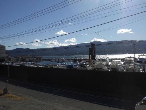 a view of a marina with boats in a harbor at Marina bay Numazu マリーナベイ沼津 BBQ可 in Numazu