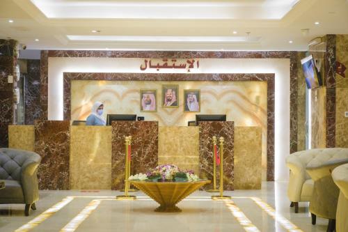 a lobby of a hotel with a reception desk at Taj Al Worood Hotel in Jeddah