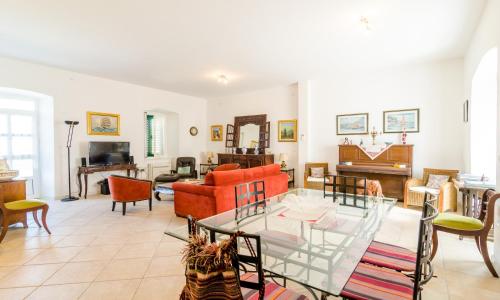 a living room with a couch and a table at Stone House DiMaTo in Gruda