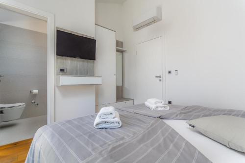 En eller flere senge i et værelse på Villa Maria Insel Krk