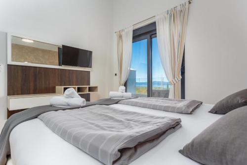 En eller flere senge i et værelse på Villa Maria Insel Krk