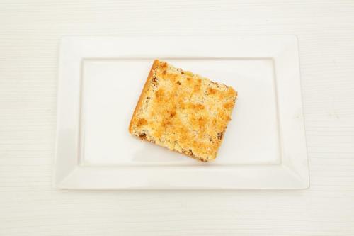 a piece of food on a white plate at Hotel Ramos Mejía in Mar del Plata