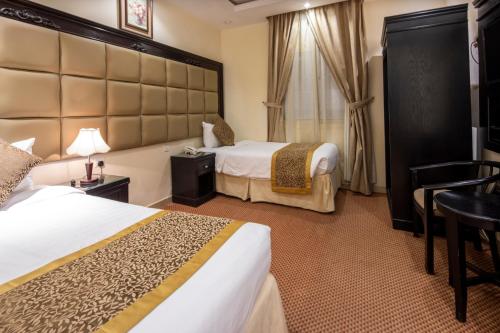 Ένα ή περισσότερα κρεβάτια σε δωμάτιο στο Kyona Alaziziyah - كيونا العزيزية
