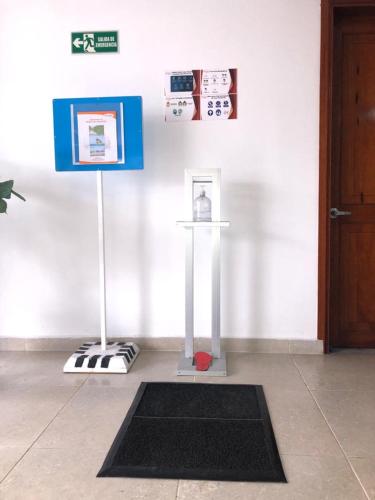 a room with a door and a black and white rug at Colon Plaza Hotel in Tumaco