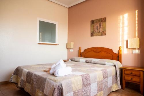 Postel nebo postele na pokoji v ubytování El Cordobés , alojamiento y habitaciones