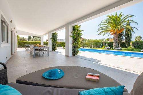 a villa with a pool and a living room at Villa Koster by Algarve Vacation in Carvoeiro