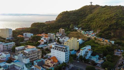 an aerial view of a city with a cross on a hill at Aquatel Vung Tau in Vung Tau