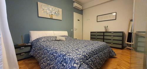 a bedroom with a bed and a dresser at Laghirla in Modena
