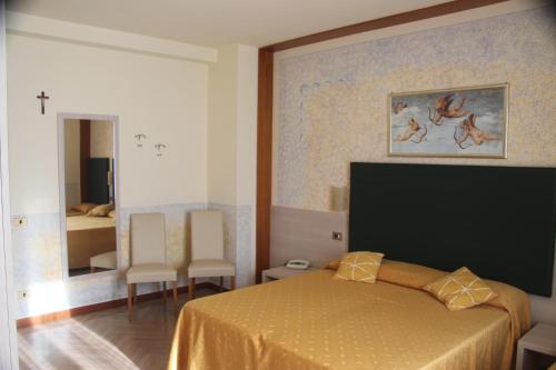 A bed or beds in a room at Albergo Sole