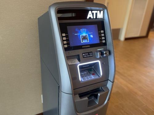an atm machine with the screen on at Holiday Inn Bangor by IHG in Bangor