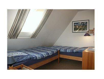 Uma cama ou camas num quarto em Haus-Mainzer-Appartement-1