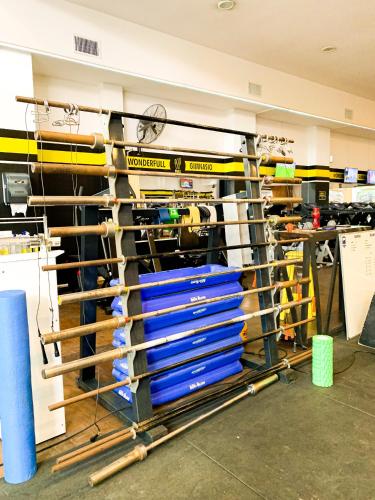 a workshop with a stack of blue metal racks at Hotel Ramos Mejía in Mar del Plata
