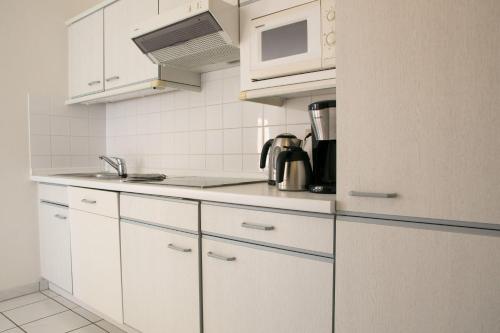 Appartement Seeluft 17 - Durchatmen und Entspannenにあるキッチンまたは簡易キッチン