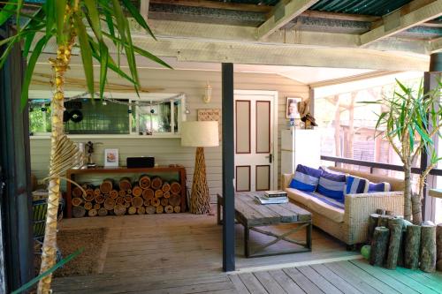 a living room with a couch and a table at The Laurels of Chinchilla in Chinchilla