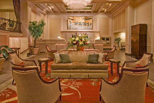 a living room filled with lots of furniture at Mayflower Park Hotel in Seattle