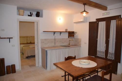 A kitchen or kitchenette at Trulli don Pietro