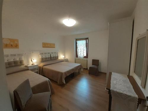 Postel nebo postele na pokoji v ubytování Ca' Albano