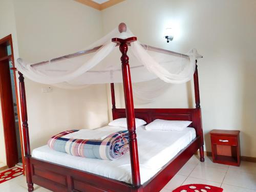מיטה או מיטות בחדר ב-Hoima Flight Motel