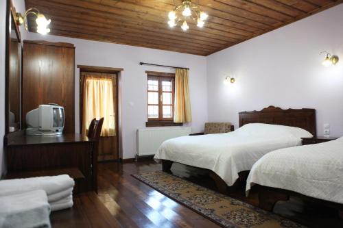 Ένα ή περισσότερα κρεβάτια σε δωμάτιο στο Ξενοδοχείο Μάνης