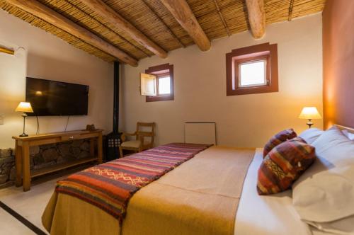 מיטה או מיטות בחדר ב-Posada de Luz