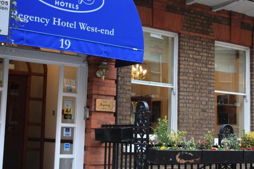 a hotel sign on the front of a building at Regency Hotel Westend in London