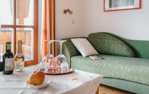 a living room with a couch and a table with wine bottles at Prinzenhof in Grossgerungs