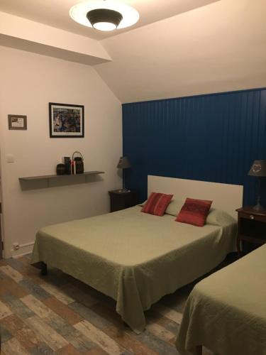 Ένα ή περισσότερα κρεβάτια σε δωμάτιο στο Maison D’hôtes