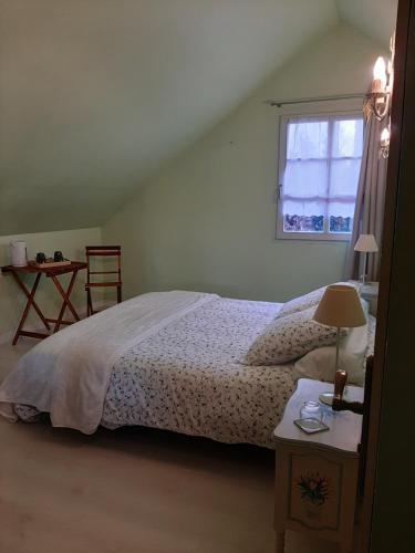 Postel nebo postele na pokoji v ubytování Ferme des capucines