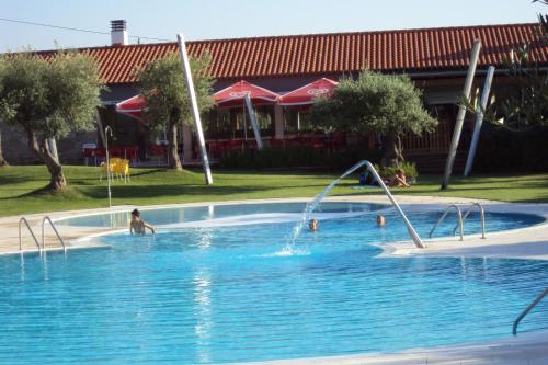 a person playing in a swimming pool at Casa da Rosa Linda in Orca