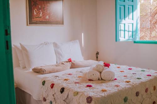 Кровать или кровати в номере Pousada Lua Cheia Caraíva