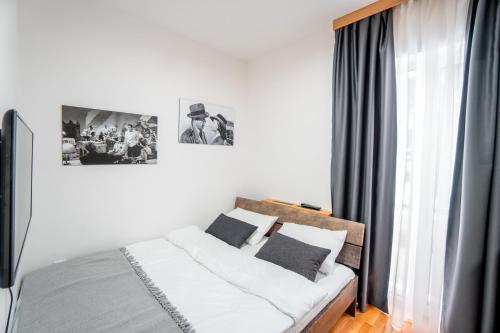 Postel nebo postele na pokoji v ubytování CENTRALA Jahorina
