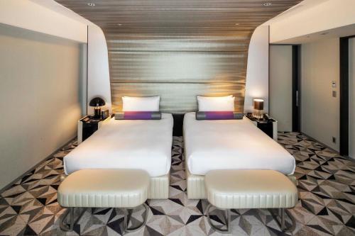 Voodi või voodid majutusasutuse The Kahala Hotel & Resort Yokohama toas