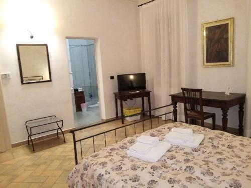 Postel nebo postele na pokoji v ubytování B&B Residence il Ciliegio , Via Villa Superiore 93 Luzzara