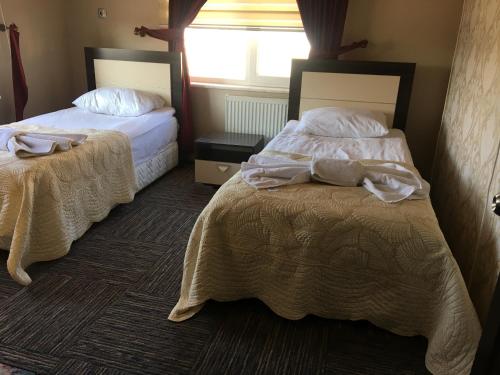 Cama o camas de una habitación en Fimaj Residence & Hotel