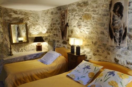 Кровать или кровати в номере Le Castélas