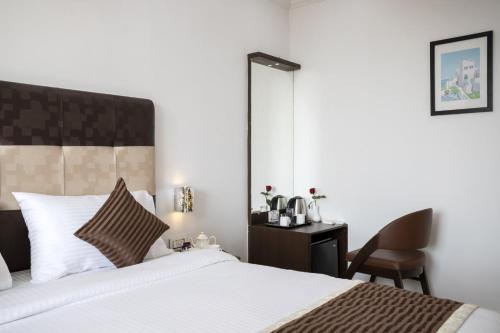 Postel nebo postele na pokoji v ubytování Sairaj Beach Resort - Calangute Goa