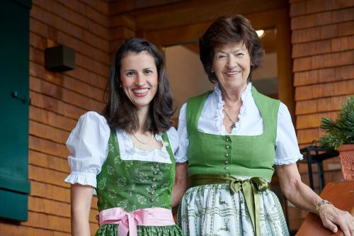 two women are standing next to each other at Hotel Garni Schneider in Lech am Arlberg