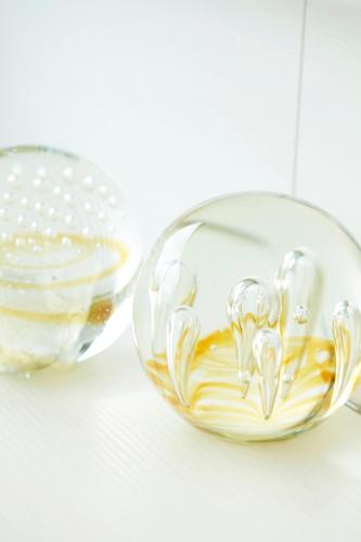 a glass bowl filled with olive oil on a table at B&B Armalot by Julia in De Panne