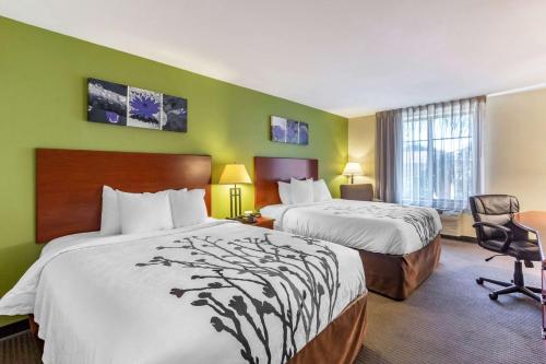 Ένα ή περισσότερα κρεβάτια σε δωμάτιο στο Sleep Inn & Suites - Jacksonville