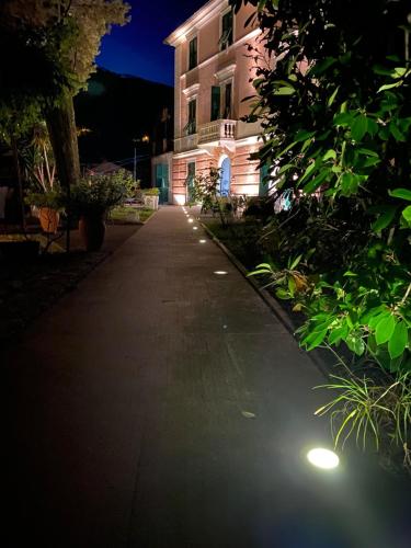 an empty street in front of a building at night at Villa Accini in Monterosso al Mare