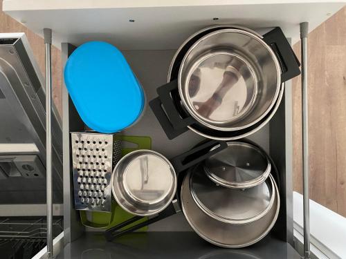 a room with several pots and pans in a kitchen at Apartment David O2 Arena Prague in Prague
