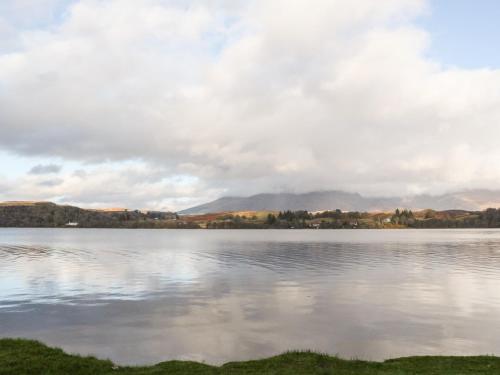 a view of a lake with mountains in the background at The Steading in Dalmally