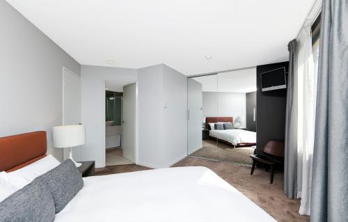 Ένα ή περισσότερα κρεβάτια σε δωμάτιο στο AAC Apartments - Griffin