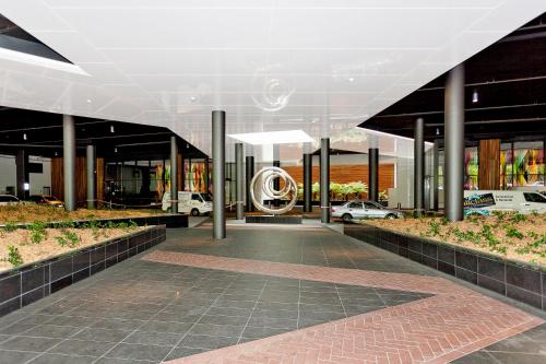a lobby of a building with a car dealership at AAC Apartments - Manhattan in Canberra
