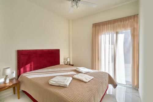 Giường trong phòng chung tại Villa Calliope