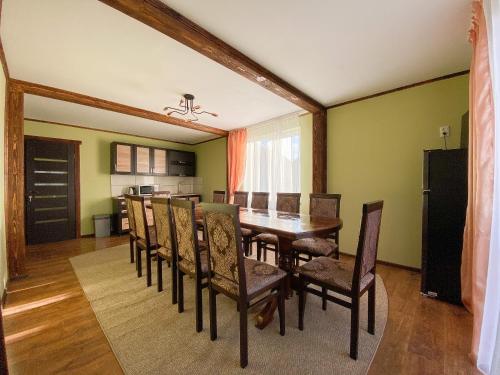 a dining room with a table and chairs at Краєвид in Vorokhta