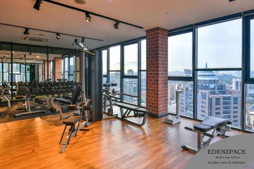 a gym with a view of a city at Ceylonz Suites by EdenZpace in Kuala Lumpur