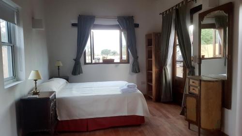 Кровать или кровати в номере Terraza del Molle
