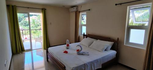 Кровать или кровати в номере Jaidss Holiday Apartments 2