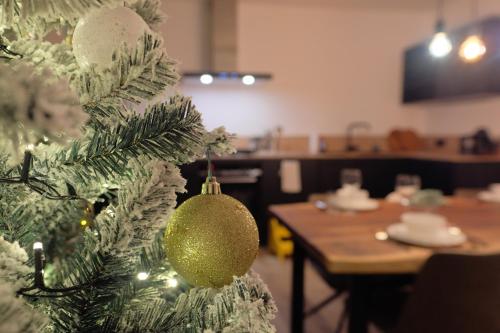 a christmas tree with a christmas ornament on it at Haus Fien in Heiligenblut